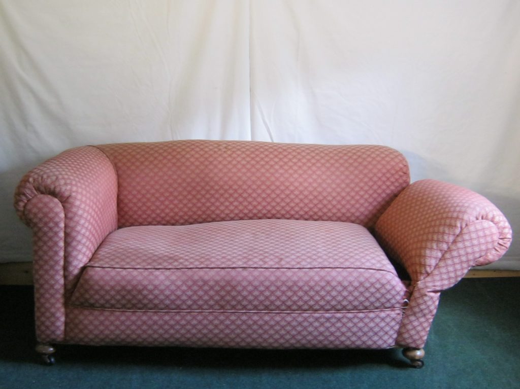 antique Chesterfield Sofa, with drop arm.