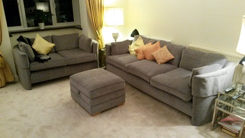 pair of sofas and footstool.