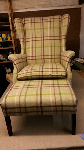 froxfield wing chair and matching stool in moon wool.